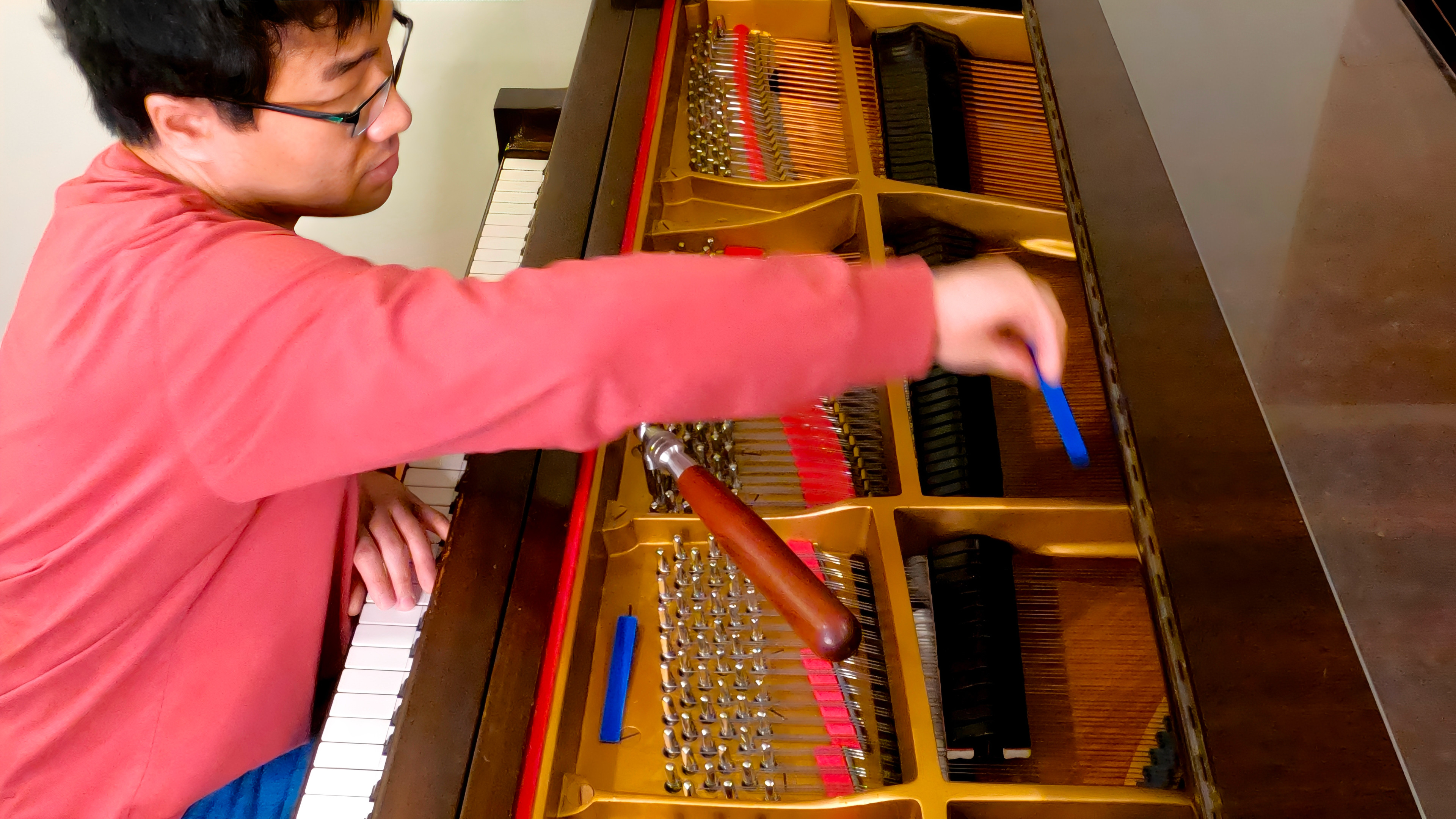 Akira Ikegami tuning a piano